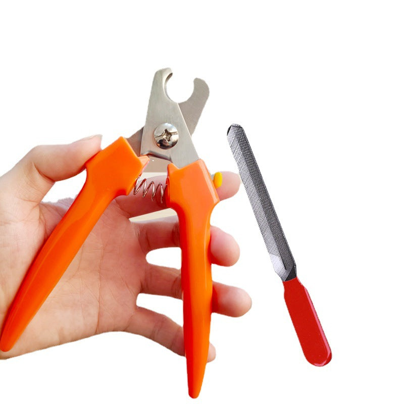 Pet nail clippers with nail file held in hand — dog and cat nail clippers by DealSpark