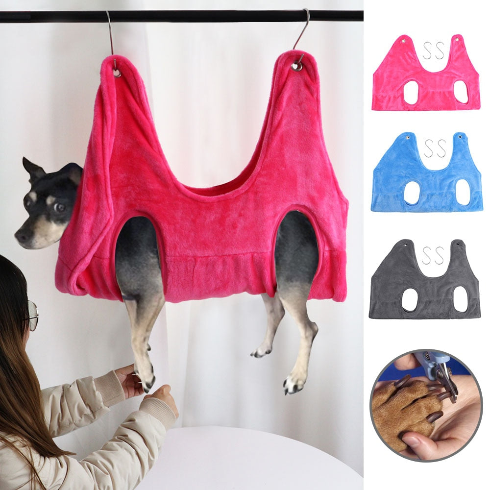 Pink dog grooming hammock in use, also shown in blue and grey