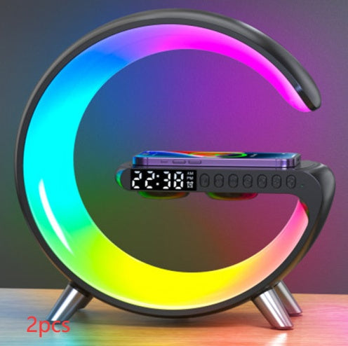 G lamp with rainbow light and a phone on the charging shelf