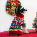 Schnauzer wearing the festive turtleneck dog sweater, side view with Christmas wreath