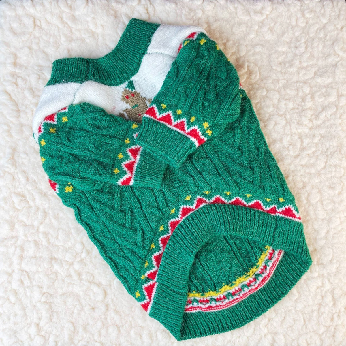 Green cable knit Christmas dog sweater, flat lay