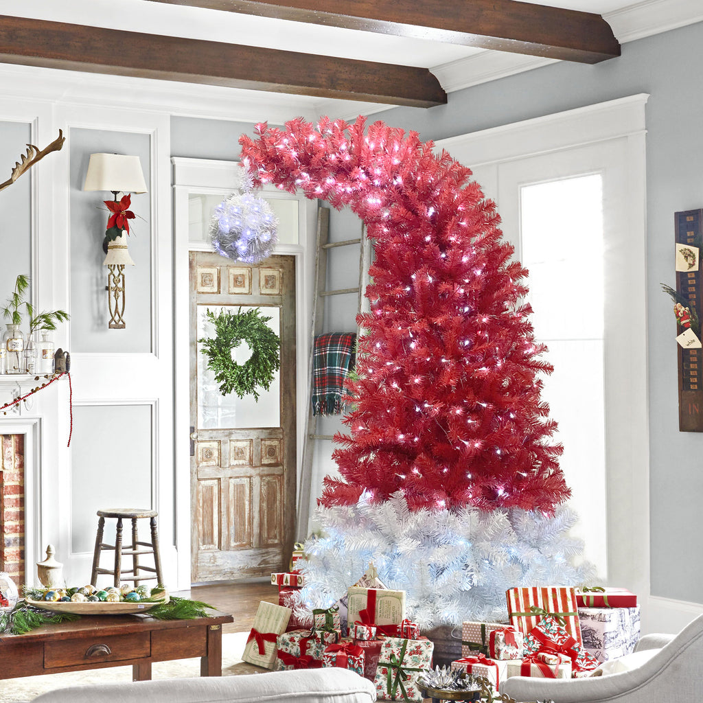 Santa hat tree in a living room with presents and a wreath