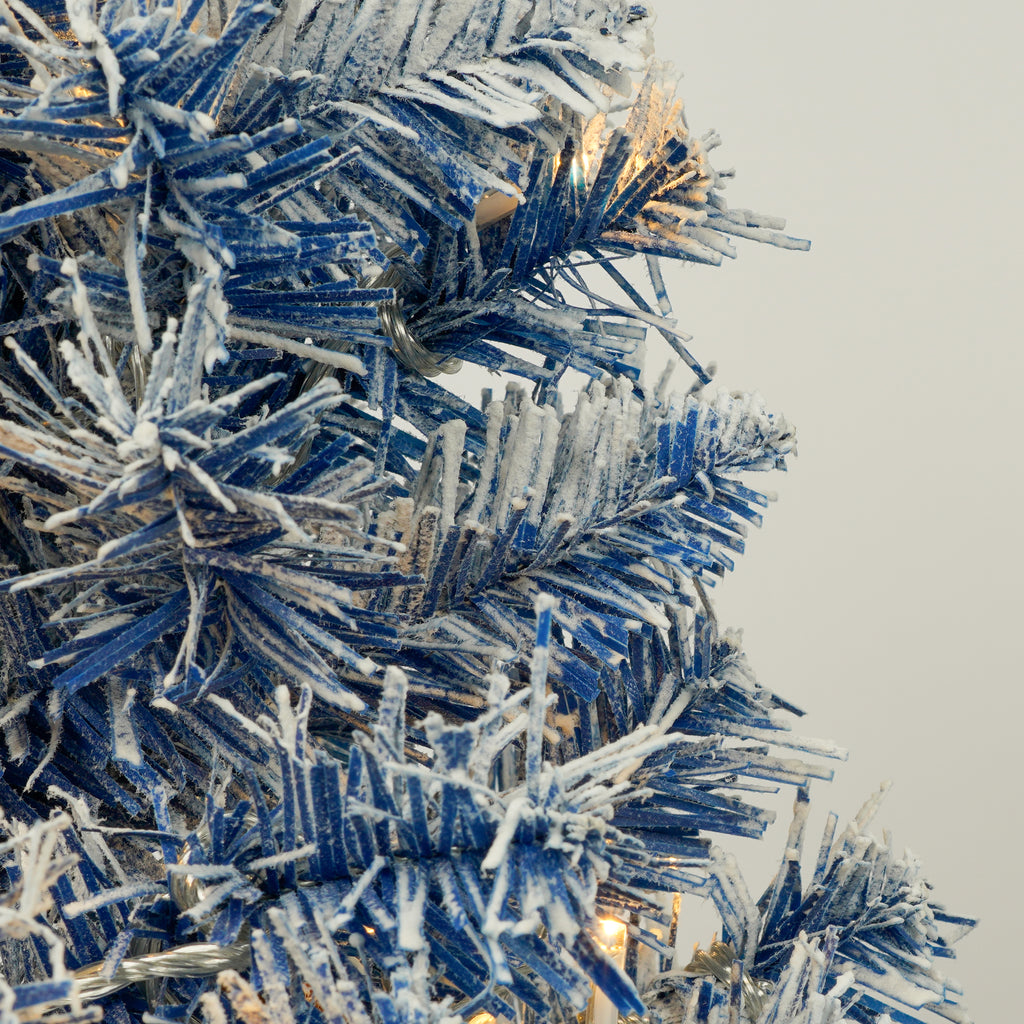 Blue flocked branch detail with an LED light