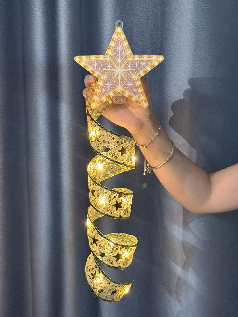 Hand holding the star LED hanging decoration