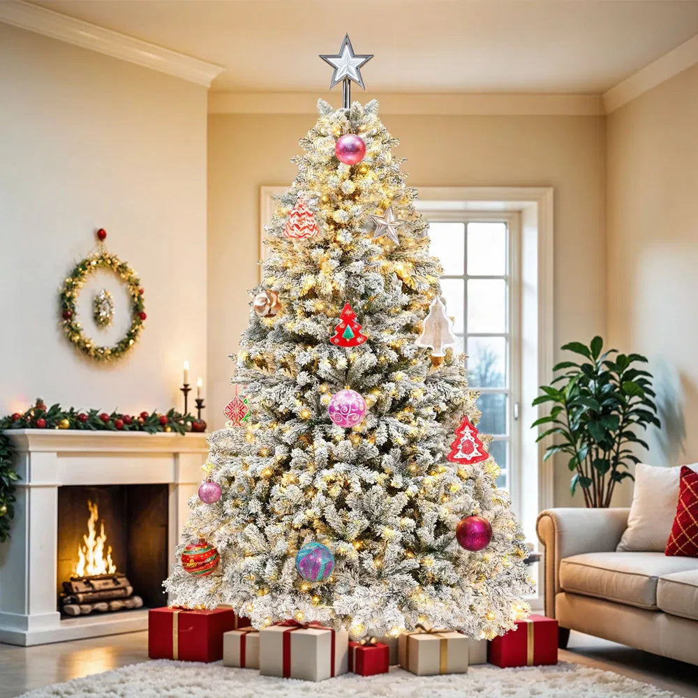 Pre-lit flocked Christmas tree with warm lights and presents