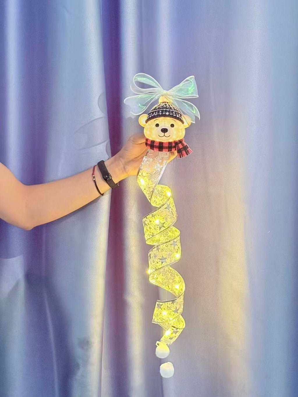 Hand holding the snowman LED hanging decoration — size view