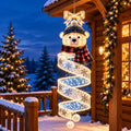 Snowman hanging light on a snowy porch