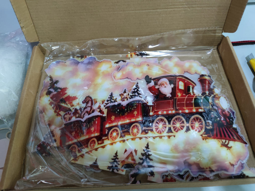 Christmas Magic Trail Wall Light packaged in its box