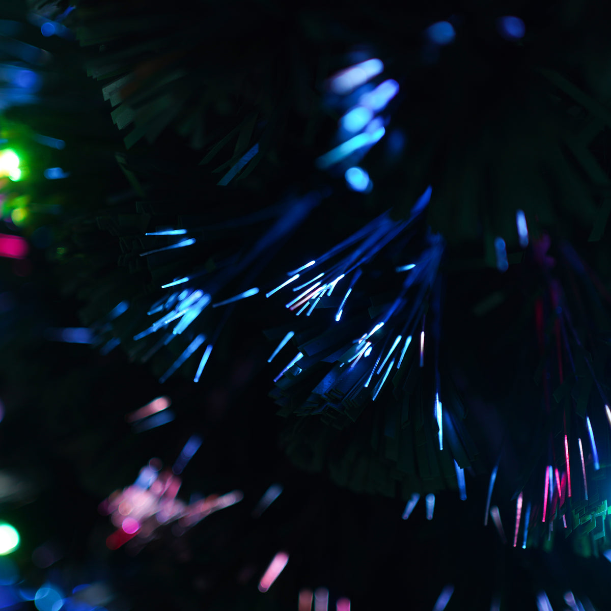 Fibre optic branch close-up with blue and purple light