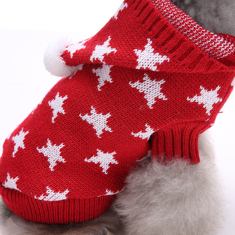Close-up of the white star knit pattern on the red dog sweater