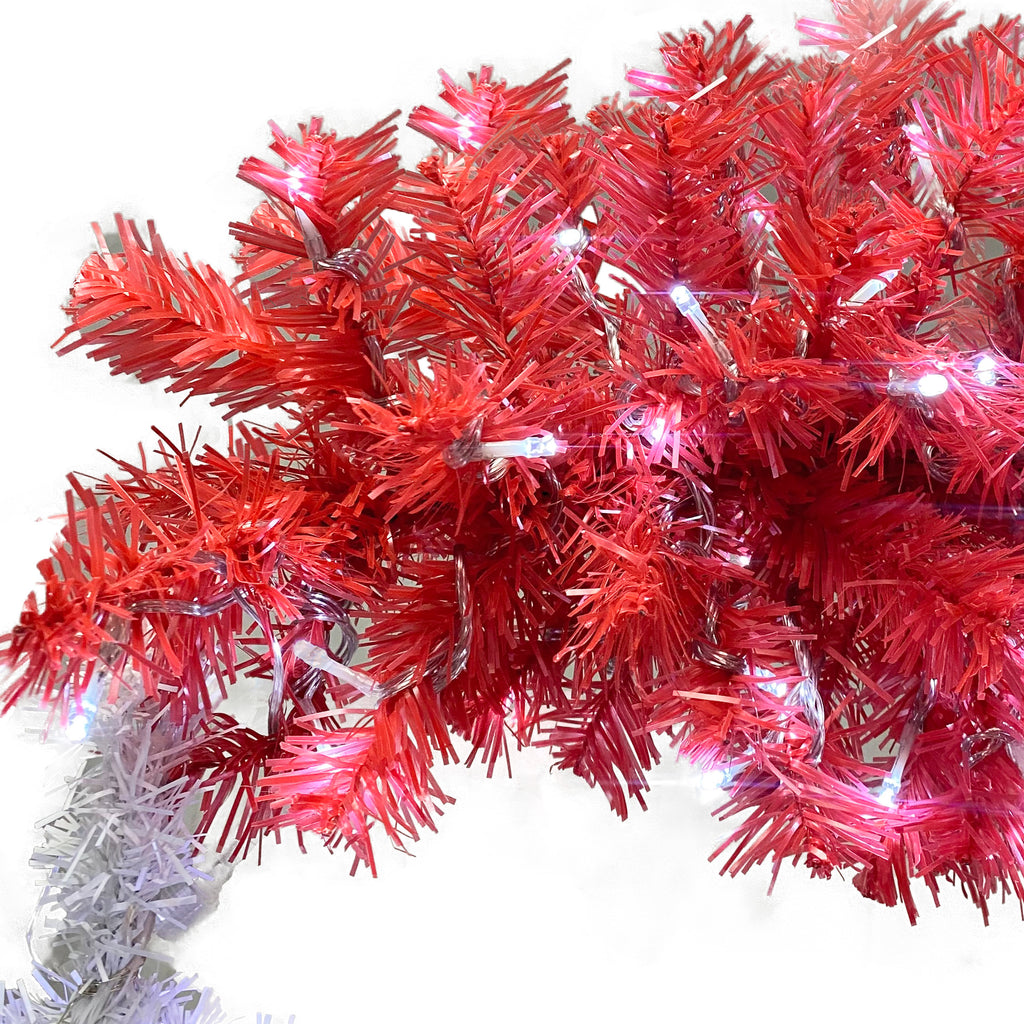 The bent Santa hat tree top lit with LEDs