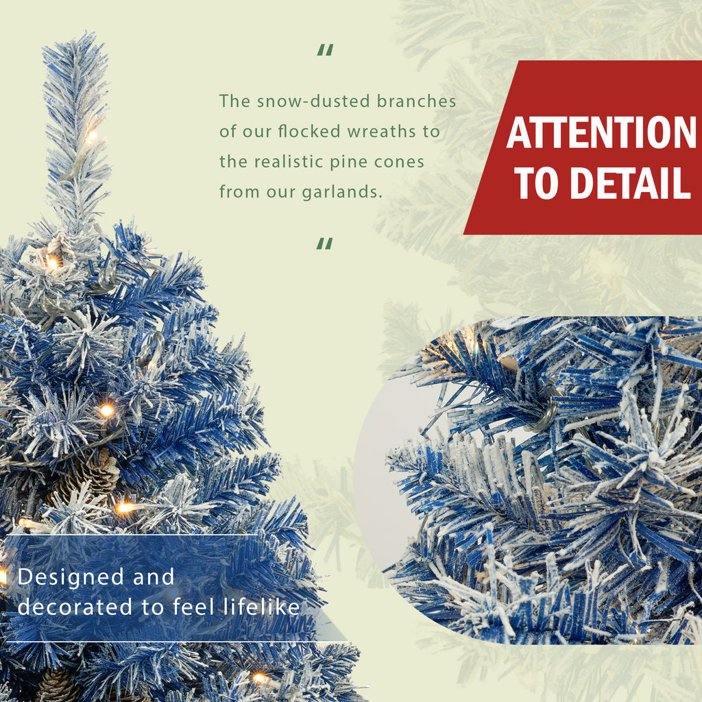 Blue flocked Christmas tree detail — lifelike snow-dusted branches