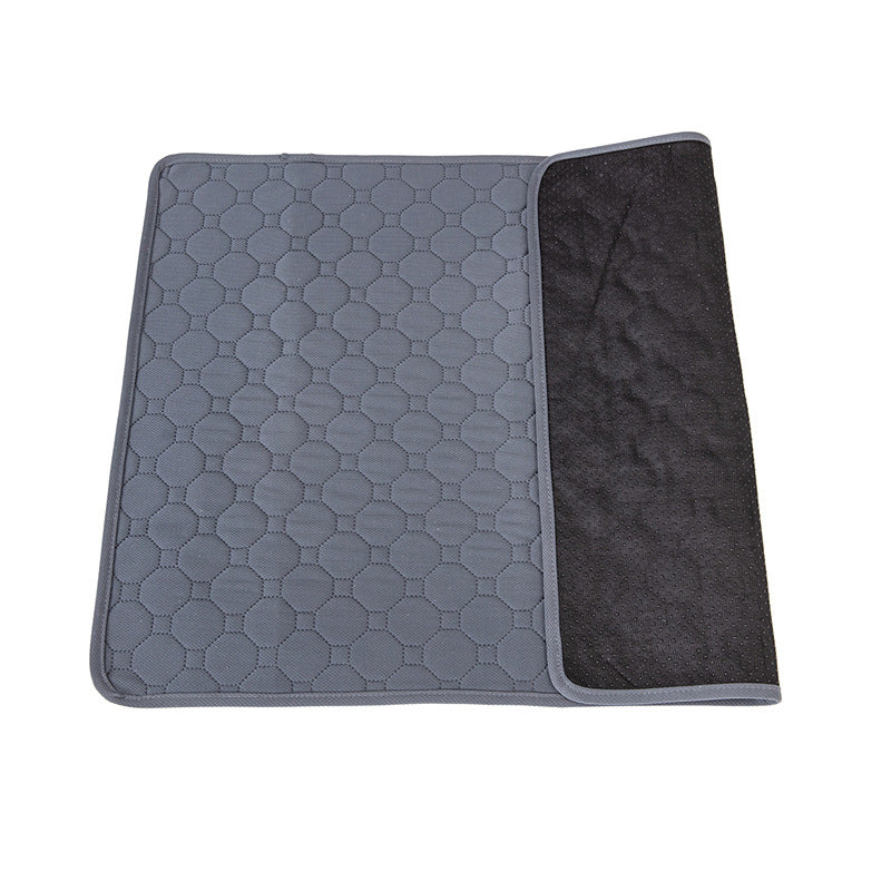 Grey reusable pee pad with the waterproof layer folded back