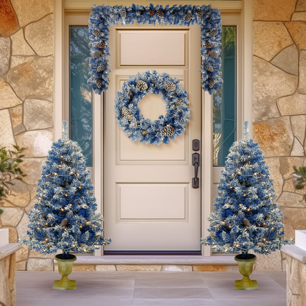 Blue pre-lit Christmas set at a front door — two entrance trees, wreath and garland by DealSpark