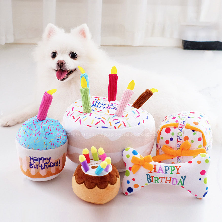 White dog with a birthday cake plush toy set for dogs by DealSpark