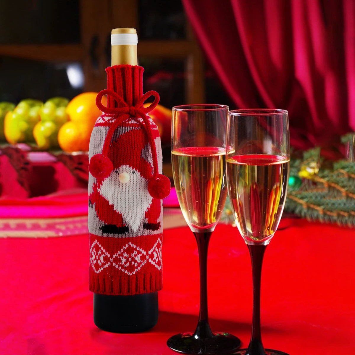 Santa wine bottle cover on a bottle at a Christmas dinner table