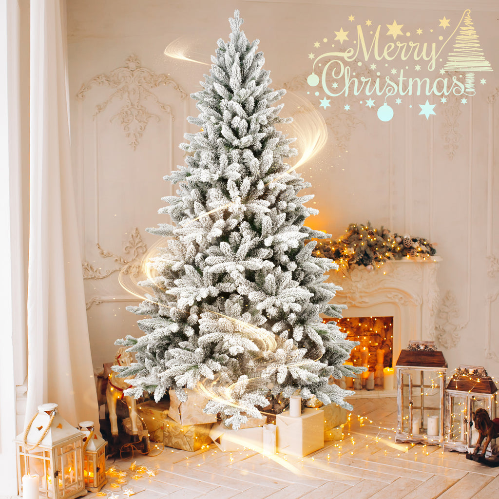 Flocked Christmas tree glowing by a fireplace