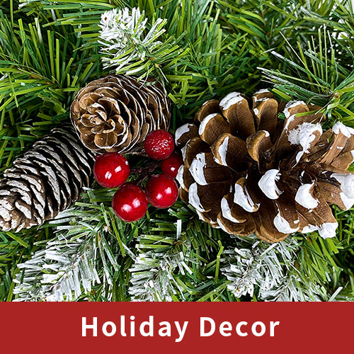 Close-up of pine cones and red berries on the garland
