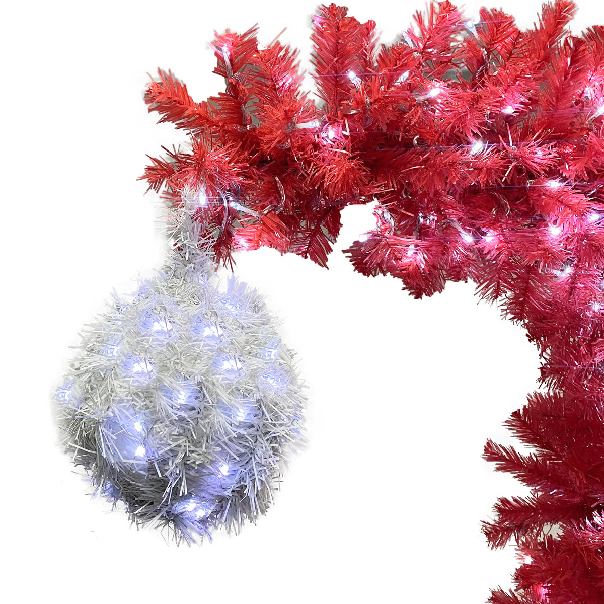 Silver pom-pom ornament hanging from the bent tree top