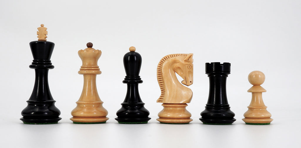 Wooden chess pieces in dark and light wood