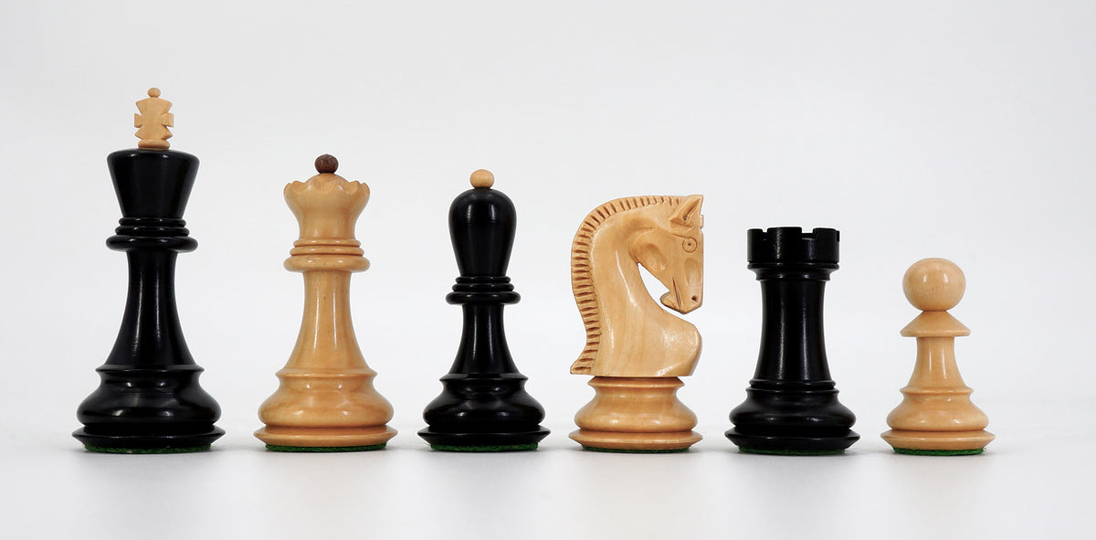 Wooden chess pieces in dark and light wood