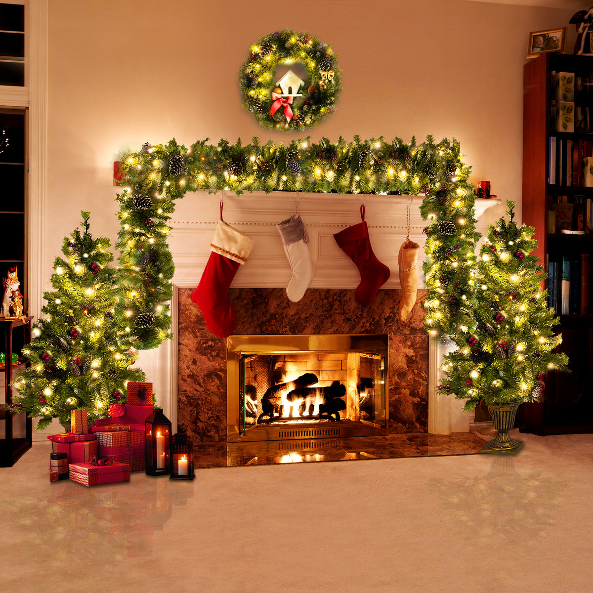 Fireplace decorated with the pre-lit trees, garland and wreath