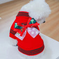 Small white dog wearing a red Christmas dog sweater with a big bow — Christmas dog sweater bundle by DealSpark