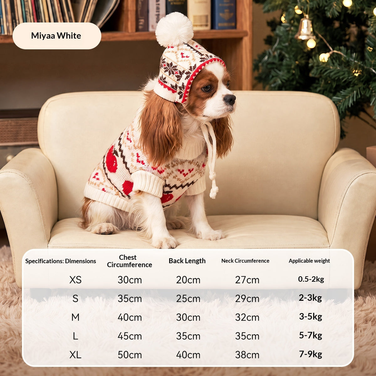 Spaniel wearing the white Meiya cable knit pet sweater and pom-pom hat, with size chart