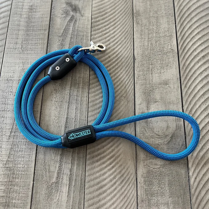 Howlster climbing rope dog leash in blue, coiled, with lobster claw clasp by DealSpark