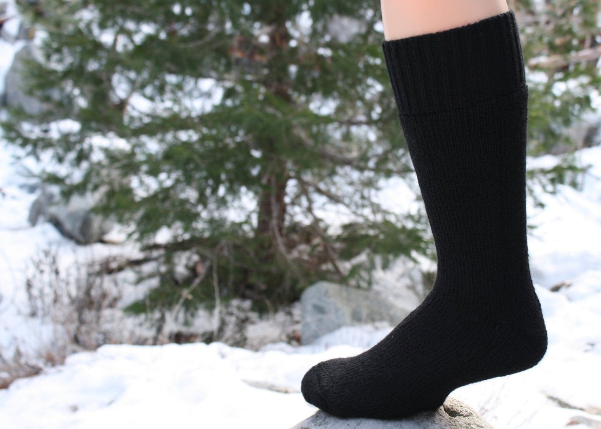Black alpaca sock worn in the snow
